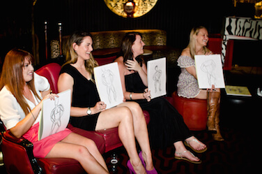 lifedrawing hens holding up their sketches