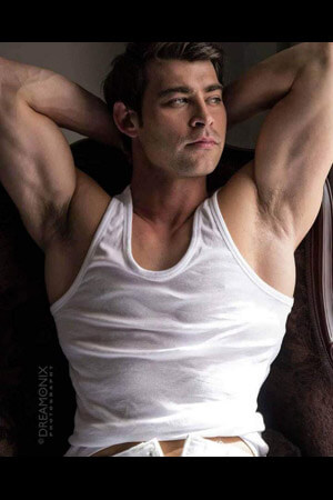 handsome hens party life drawing model posing in a white singlet in auckland's arch hill