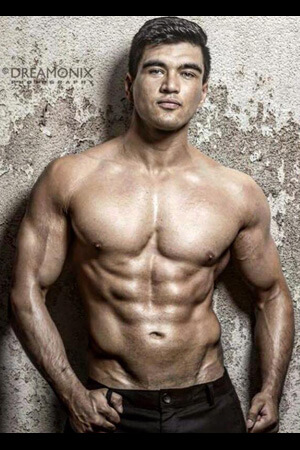 dark haired topless waiter with fantastically chiselled abs and chest
