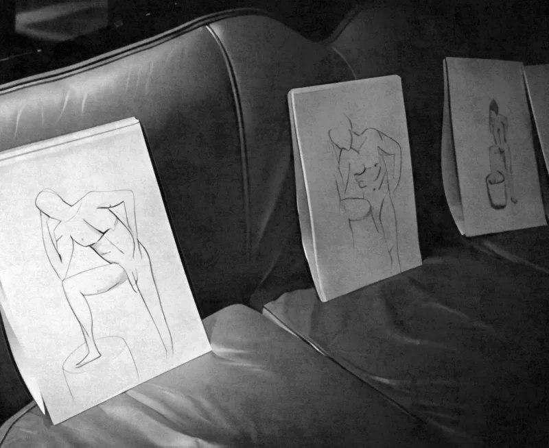 Sketch pads and pencils set out for a Hens Knights life drawing session