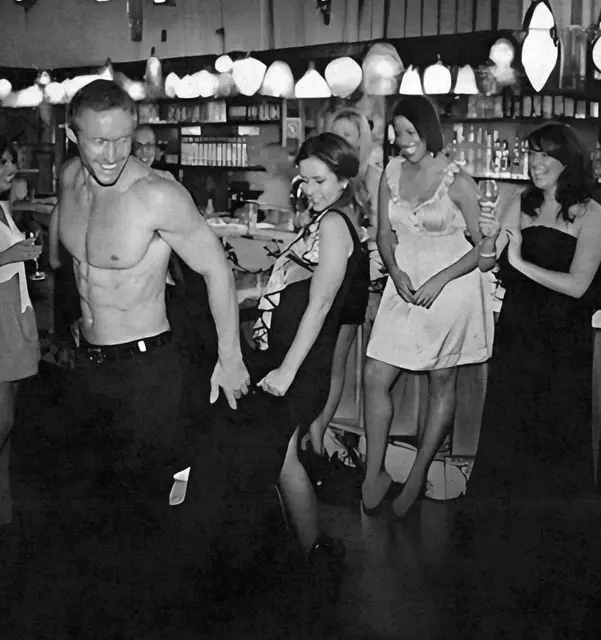Male stripper mid-performance at a Hen's Knights hens night