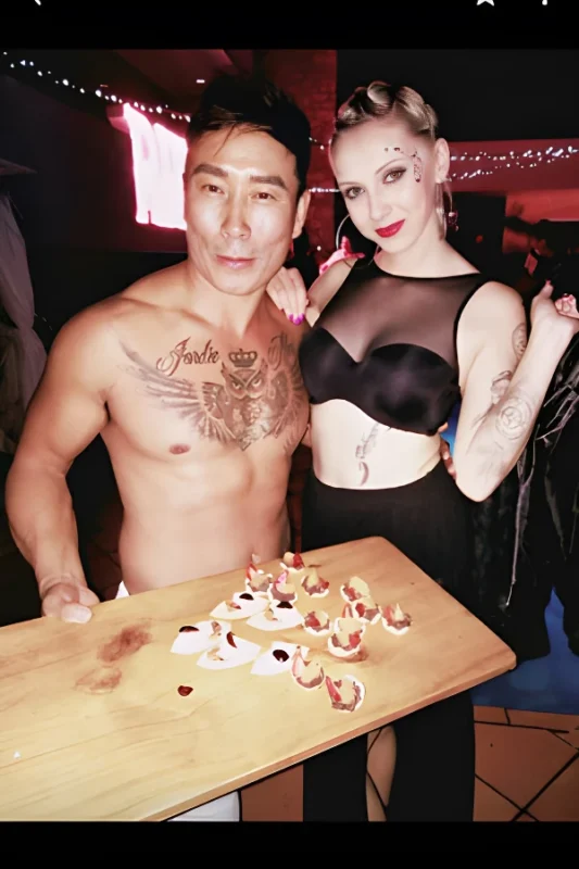 Buff butler style topless waiter ready to serve at a hens party